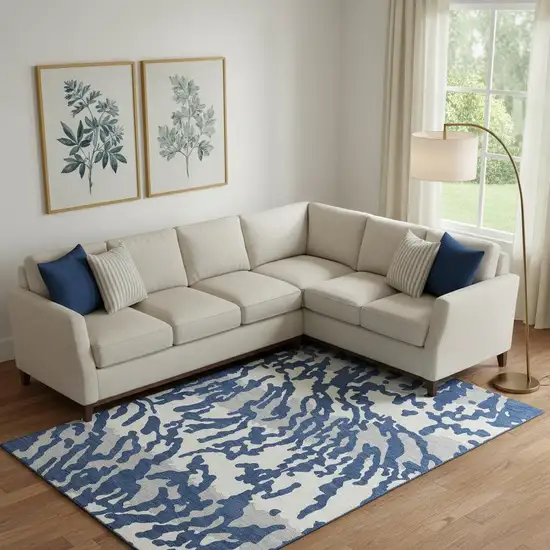 Navy Blue And Ivory Animal Print Washable Area Rug With UV Protection Photo 1