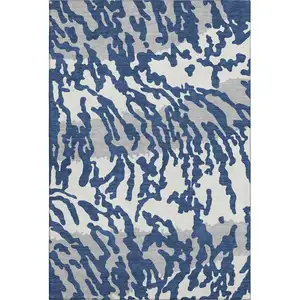 Photo of Navy Blue And Ivory Animal Print Washable Area Rug With UV Protection