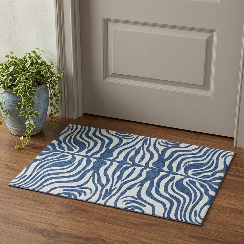 Navy Blue And Ivory Animal Print Washable Area Rug With UV Protection Photo 1