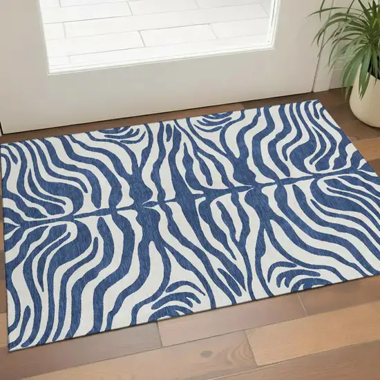 Navy Blue And Ivory Animal Print Washable Area Rug With UV Protection Photo 1