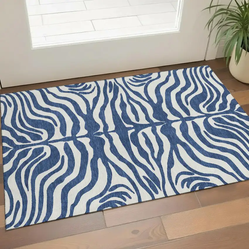 Navy Blue And Ivory Animal Print Washable Area Rug With UV Protection Photo 1
