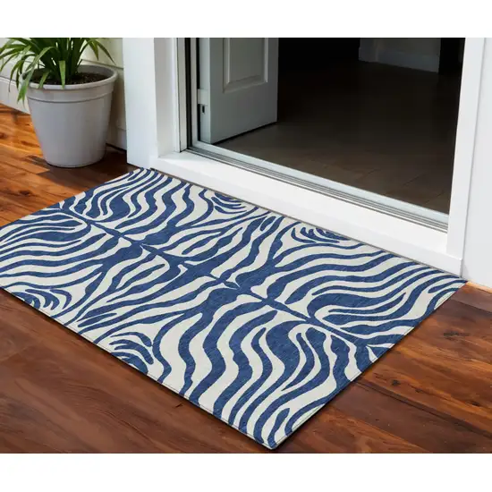Navy Blue And Ivory Animal Print Washable Indoor Outdoor Area Rug Photo 1