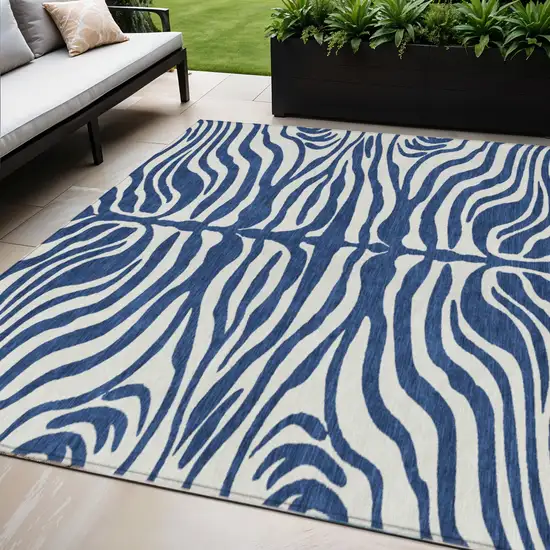 Navy Blue And Ivory Animal Print Washable Indoor Outdoor Area Rug Photo 1