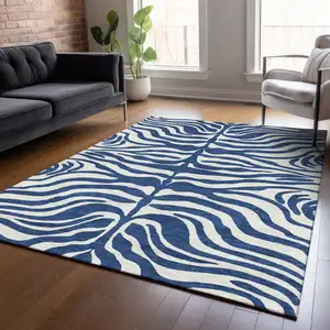 Photo of Navy Blue And Ivory Animal Print Washable Indoor Outdoor Area Rug