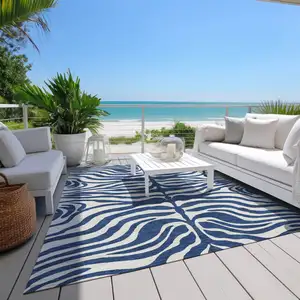 Photo of Navy Blue And Ivory Animal Print Washable Indoor Outdoor Area Rug