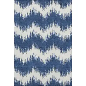 Photo of Navy Blue And Ivory Chevron Washable Area Rug With UV Protection