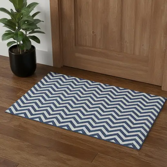 Navy Blue And Ivory Chevron Washable Area Rug With UV Protection Photo 1
