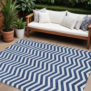 Photo of Navy Blue And Ivory Chevron Washable Indoor Outdoor Area Rug