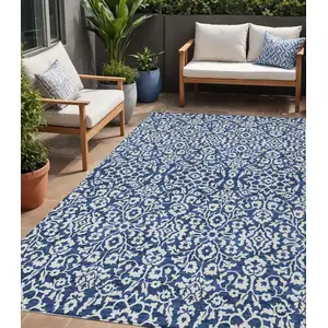 Photo of Navy Blue And Ivory Damask Washable Indoor Outdoor Area Rug