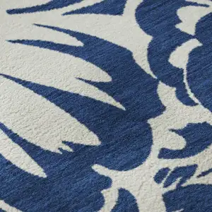 Photo of Navy Blue And Ivory Floral Washable Area Rug With UV Protection