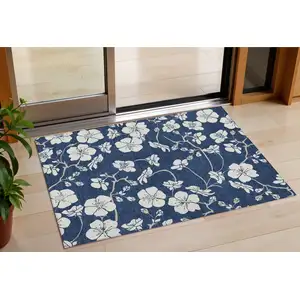 Photo of Navy Blue And Ivory Floral Washable Indoor Outdoor Area Rug