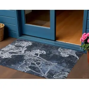 Photo of Navy Blue And Ivory Floral Washable Indoor Outdoor Area Rug