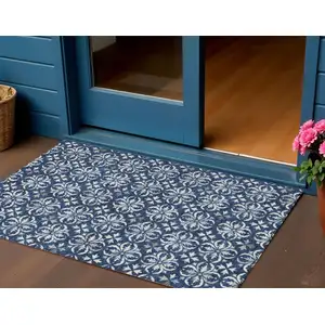 Photo of Navy Blue And Ivory Floral Washable Indoor Outdoor Area Rug