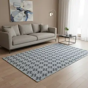 Photo of Navy Blue And Ivory Geometric Washable Area Rug With UV Protection