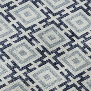 Photo of Navy Blue And Ivory Geometric Washable Area Rug With UV Protection