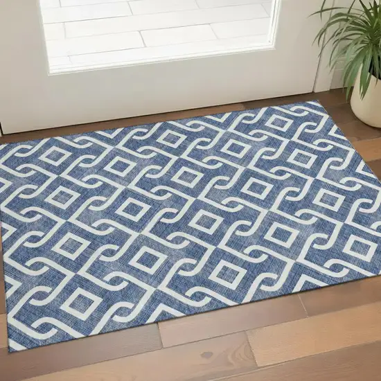 Navy Blue And Ivory Geometric Washable Area Rug With UV Protection Photo 1