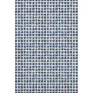 Photo of Navy Blue And Ivory Geometric Washable Area Rug With UV Protection