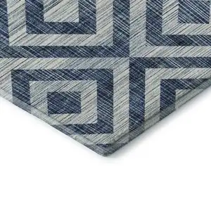 Photo of Navy Blue And Ivory Geometric Washable Area Rug With UV Protection