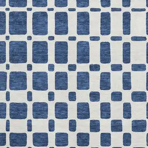 Photo of Navy Blue And Ivory Geometric Washable Area Rug With UV Protection