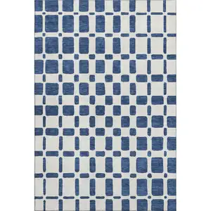 Photo of Navy Blue And Ivory Geometric Washable Area Rug With UV Protection