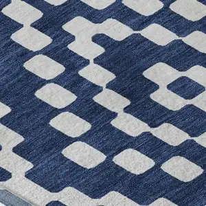 Photo of Navy Blue And Ivory Geometric Washable Area Rug With UV Protection