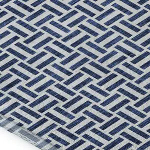 Photo of Navy Blue And Ivory Geometric Washable Area Rug With UV Protection