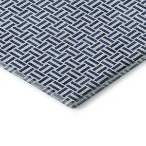 Photo of Navy Blue And Ivory Geometric Washable Area Rug With UV Protection