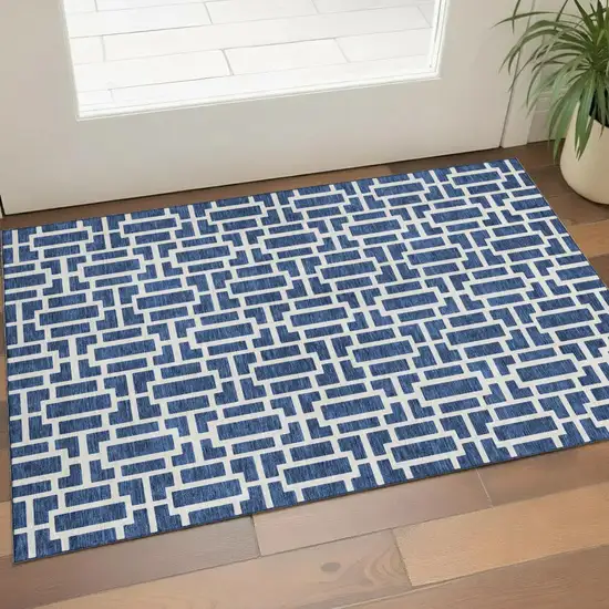 Navy Blue And Ivory Geometric Washable Area Rug With UV Protection Photo 1