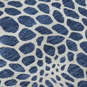 Photo of Navy Blue And Ivory Geometric Washable Area Rug With UV Protection