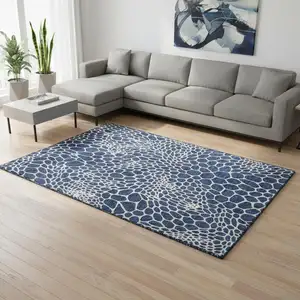 Photo of Navy Blue And Ivory Geometric Washable Area Rug With UV Protection