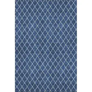 Photo of Navy Blue And Ivory Geometric Washable Area Rug With UV Protection