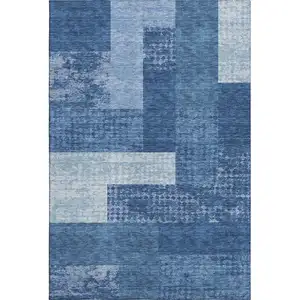 Photo of Navy Blue And Ivory Geometric Washable Area Rug With UV Protection