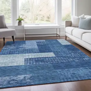 Photo of Navy Blue And Ivory Geometric Washable Area Rug With UV Protection