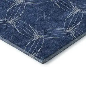 Photo of Navy Blue And Ivory Geometric Washable Area Rug With UV Protection