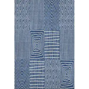Photo of Navy Blue And Ivory Geometric Washable Area Rug With UV Protection