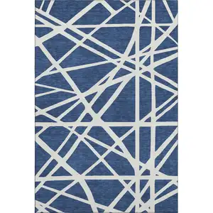Photo of Navy Blue And Ivory Geometric Washable Area Rug With UV Protection