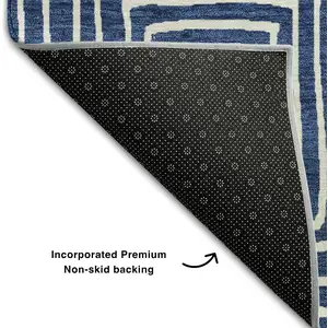Photo of Navy Blue And Ivory Geometric Washable Area Rug With UV Protection