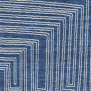 Photo of Navy Blue And Ivory Geometric Washable Area Rug With UV Protection