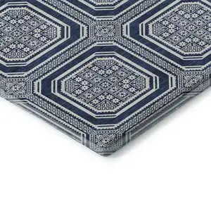 Photo of Navy Blue And Ivory Geometric Washable Area Rug With UV Protection