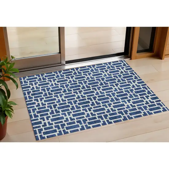 Navy Blue And Ivory Geometric Washable Indoor Outdoor Area Rug Photo 1