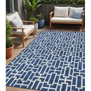 Photo of Navy Blue And Ivory Geometric Washable Indoor Outdoor Area Rug