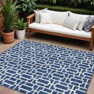 Photo of Navy Blue And Ivory Geometric Washable Indoor Outdoor Area Rug