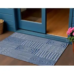 Photo of Navy Blue And Ivory Geometric Washable Indoor Outdoor Area Rug