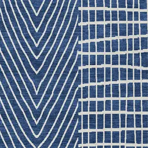 Photo of Navy Blue And Ivory Geometric Washable Indoor Outdoor Area Rug