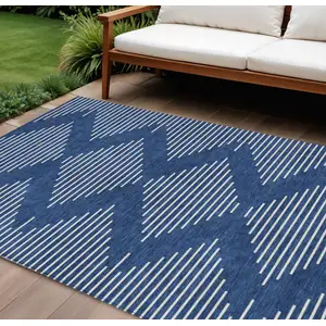 Photo of Navy Blue And Ivory Geometric Washable Indoor Outdoor Area Rug
