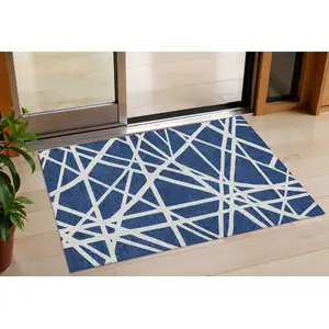 Photo of Navy Blue And Ivory Geometric Washable Indoor Outdoor Area Rug