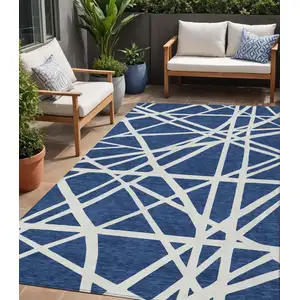 Photo of Navy Blue And Ivory Geometric Washable Indoor Outdoor Area Rug