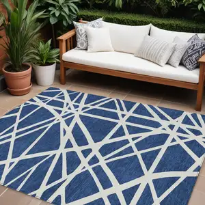 Photo of Navy Blue And Ivory Geometric Washable Indoor Outdoor Area Rug