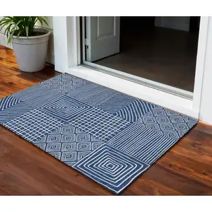 Photo of Navy Blue And Ivory Geometric Washable Indoor Outdoor Area Rug