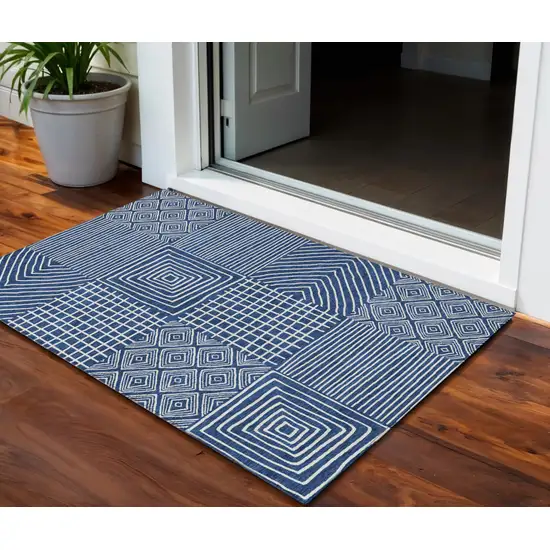 Navy Blue And Ivory Geometric Washable Indoor Outdoor Area Rug Photo 1